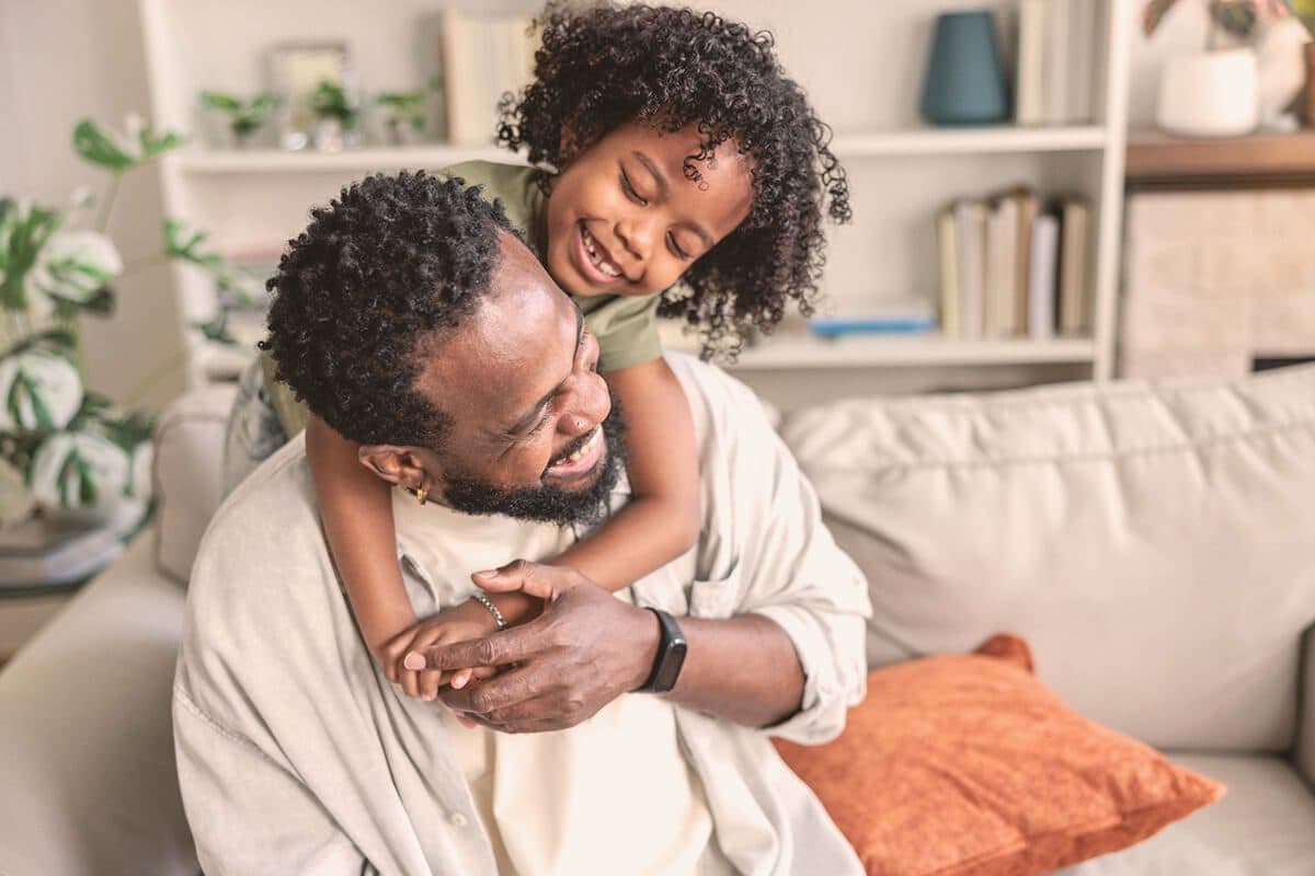 A father and child laughing together