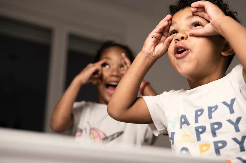 Two children making funny faces
